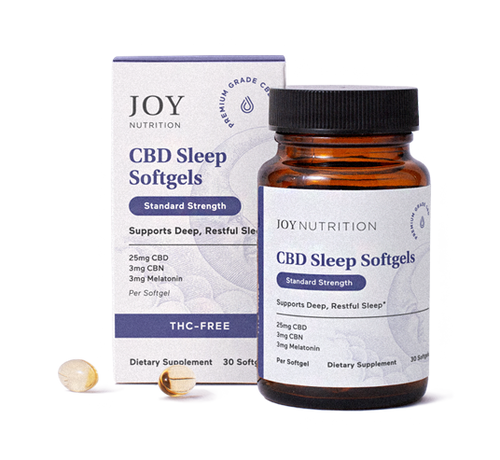 Bottle of Joy Nutrition CBD Sleep Softgels with purple and white packaging box and amber glass container with black cap.